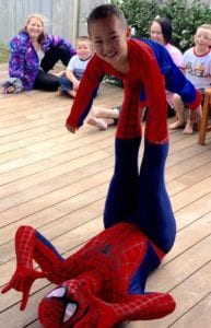 Spiderman gives spiderboy a lift