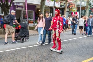 Ironman on hoverboard with mask open Takapuna