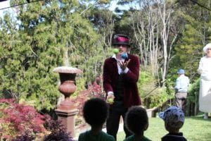 Mad Hatter juggling at 80th birthday garden party