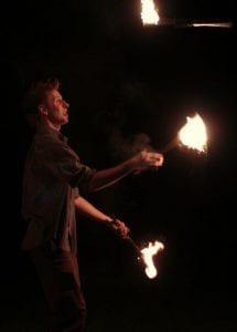 Fire performer juggling flames